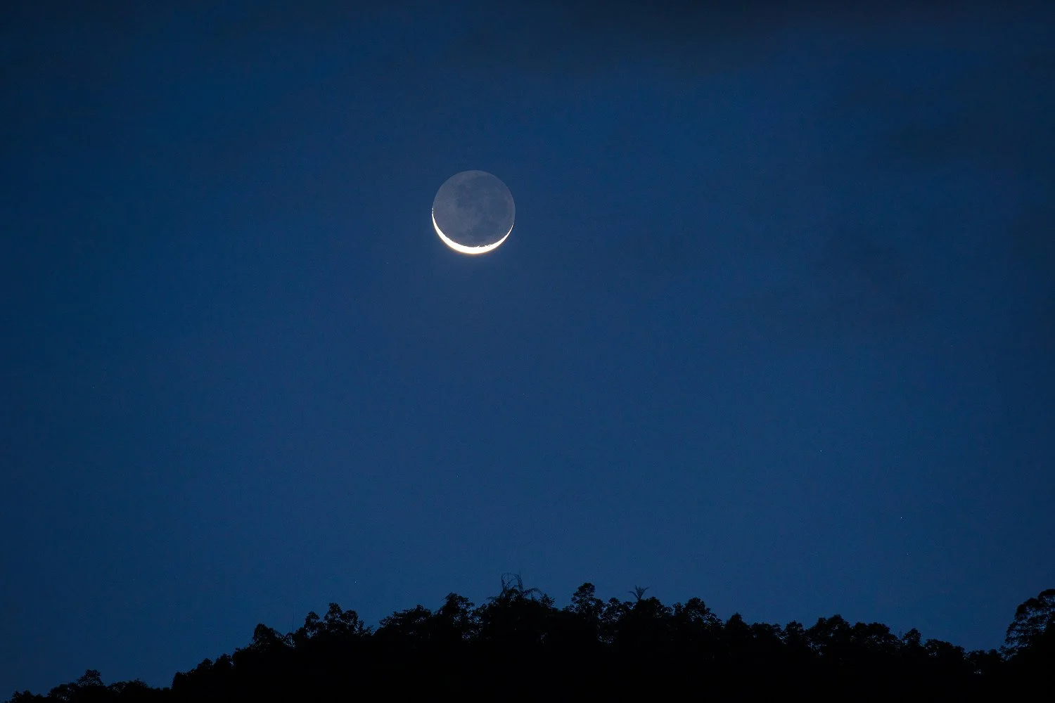 Calm evening scene with moonlight representing mindful evening routines